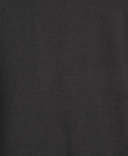 A textured black fabric featuring a subtle weave pattern. Ideal for stylish polo shirts.