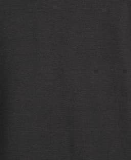 A black polo shirt made from popcorn cotton fabric, featuring a logo on the design.