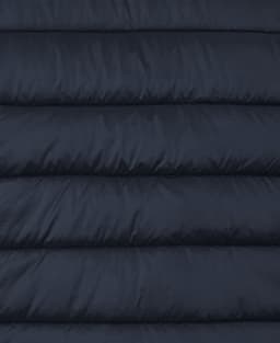 A dark navy puffer vest featuring quilted sections and a logo. The fabric has a smooth finish.