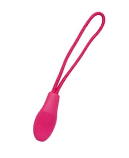 A pink changeable zip puller with a textured grip and a loop for easy attachment.