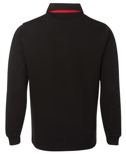 A two-tone black rugby shirt with a red collar, featuring long sleeves and a logo on the front.