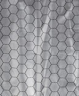 A textured fabric featuring a hexagonal pattern in black and grey, typical for outdoor vests.
