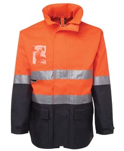 A high-visibility jacket in orange and black, featuring reflective stripes and a pocket. It has a logo on the front.