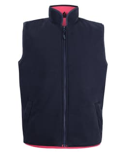 A navy reversible vest with a high collar and zippers, featuring contrasting red lining and pockets.