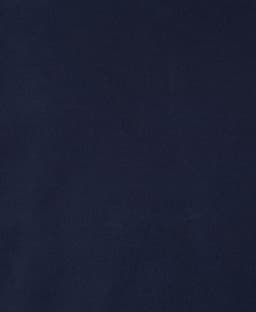 A dark navy reversible vest made from soft fabric, featuring a subtle texture and a logo on the design.
