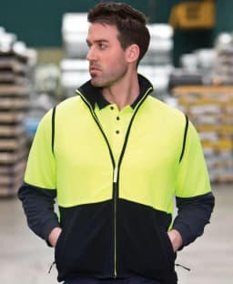 A high-visibility polar vest in bright yellow and black, featuring a zip and collar, worn by a man.