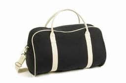 A black bag with cream accents, featuring handles and a shoulder strap, and a logo design.