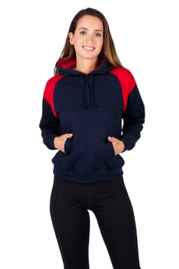 A woman wearing a navy and red shoulder contrast panel hoodie with a pocket and hood. The hoodie has a logo.