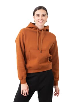 A brown kangaroo pocket hoodie featuring a relaxed fit and drawstring hood, modelled by a woman.