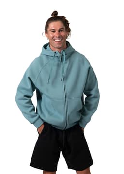 A man wearing a teal cotton zip-up hoodie with a kangaroo pocket and black shorts, smiling at the camera.