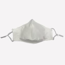 A white face mask made of 100% cotton with adjustable toggle straps. It features a simple design and has a logo.