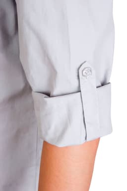 A light grey women's long sleeve military shirt with rolled-up sleeves and a button detail. It features a logo.
