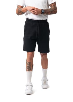 Black cotton dress shorts with an elastic waistband and side pockets, featuring a logo on the leg.