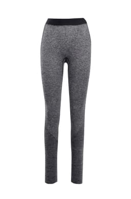 A pair of seamless leggings in shades of grey with a black waistband and a logo.