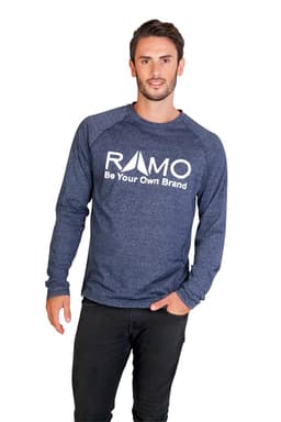 A man wearing a navy long sleeve shirt, featuring a logo on the front, stands against a white background.