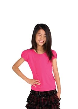 A pink short puff sleeve T-shirt for girls, paired with a black plaid skirt, modelled by a smiling girl.