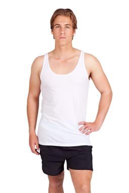 A young man in a fitted white singlet and light blue jeans, smiling and standing against a plain background.