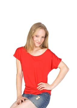 A red women's bat wing T-shirt displayed on a model, featuring a relaxed fit and bat wing sleeves.