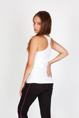 A white kids' T-back singlet is displayed on a model, paired with black pants and featuring a simple design.