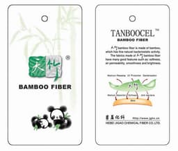 A tag displaying bamboo fibre properties, featuring a green and white logo, with panda illustrations and care instructions.