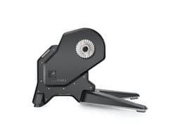 A black Garmin Tacx FLUX S Smart Trainer with a sleek design and integrated bike cassette mount.