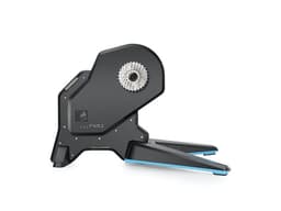 A black and blue Garmin Tacx FLUX 2 Smart Trainer with a distinctive gear cassette design.
