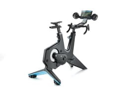A black Garmin Tacx NEO Bike Smart Trainer with a mounted screen and handlebars for cycling training.