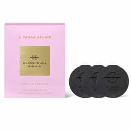 A pink box containing three black scent discs labelled "Vanilla Caramel" for a car diffuser refill.
