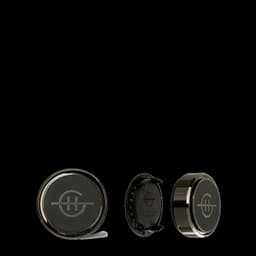 A black car diffuser with a glossy finish and a branded emblem, displayed from multiple angles.