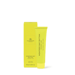 A hand cream tube in bright yellow, featuring a box, labelled Montego Bay Rhythm, 75ml size, with a logo.