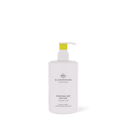 A white hand lotion bottle with a yellow pump, labelled "Montego Bay Rhythm" in a clean design.