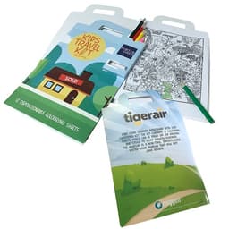 A travel kit featuring a colouring book, coloured pencils, and a logo, all in vibrant colours.
