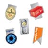 A collection of magnets featuring various designs, including a logo, a drink can, a mobile phone, and a decorative flag.