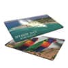 A double-sided magnet measuring 55x90mm, featuring vibrant images of a beach and colourful patterns. It has a logo.