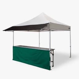 A marquee with a white and black canopy and a green half wall, featuring a silver frame and a table underneath.
