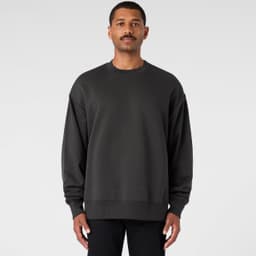 A dark grey sweater with a relaxed fit, featuring long sleeves and a crew neckline. It has a logo on it.