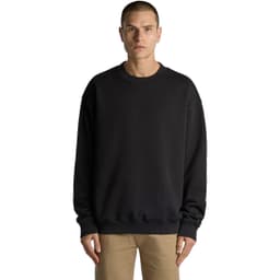 A black sweater with a relaxed fit, featuring a round neck and long sleeves. The model stands facing forward.