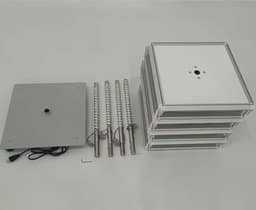 A rotating light box kit featuring a base, multiple panels, and three adjustable poles in silver and white.