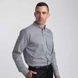 A men's button-up shirt in grey, featuring a button-down collar and a chest pocket, with a logo on the side.