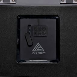 A black sound box with a control panel featuring buttons and a plug-in compartment, along with a logo.