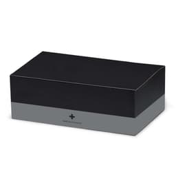 A black first aid kit box with a grey band, featuring a logo and containing essential medical supplies.