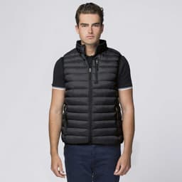 A black puffer vest with a high collar and zippered pockets, worn by a model. The vest features a logo.