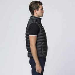 A black baffle vest featuring a zippered pocket, showcasing a sleek, fitted design from the side.