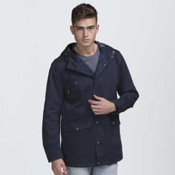 A navy blue jacket with a hood and multiple pockets, featuring a logo. Modelled by a young man.
