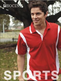 A red and white unisex polo shirt with a logo, worn by a smiling man outdoors.