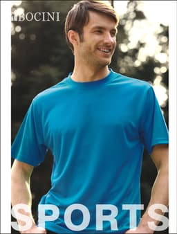A man wearing a bright blue micromesh tee shirt stands outdoors, smiling. The shirt features a logo.