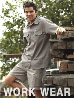 Unisex adults cotton drill cargo shorts in grey, featuring pockets and a logo, styled as workwear.