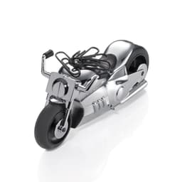 A metallic chrome motorbike model with black detailing, featuring wire handles, suitable for office decor.