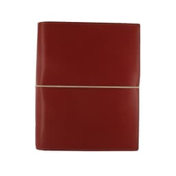 A red A5 organiser with a smooth finish, secured by a rubber band, featuring a logo on the front.