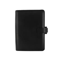 A black organiser in a sleek design, featuring a clasp closure and a smooth finish. It includes a branding logo.